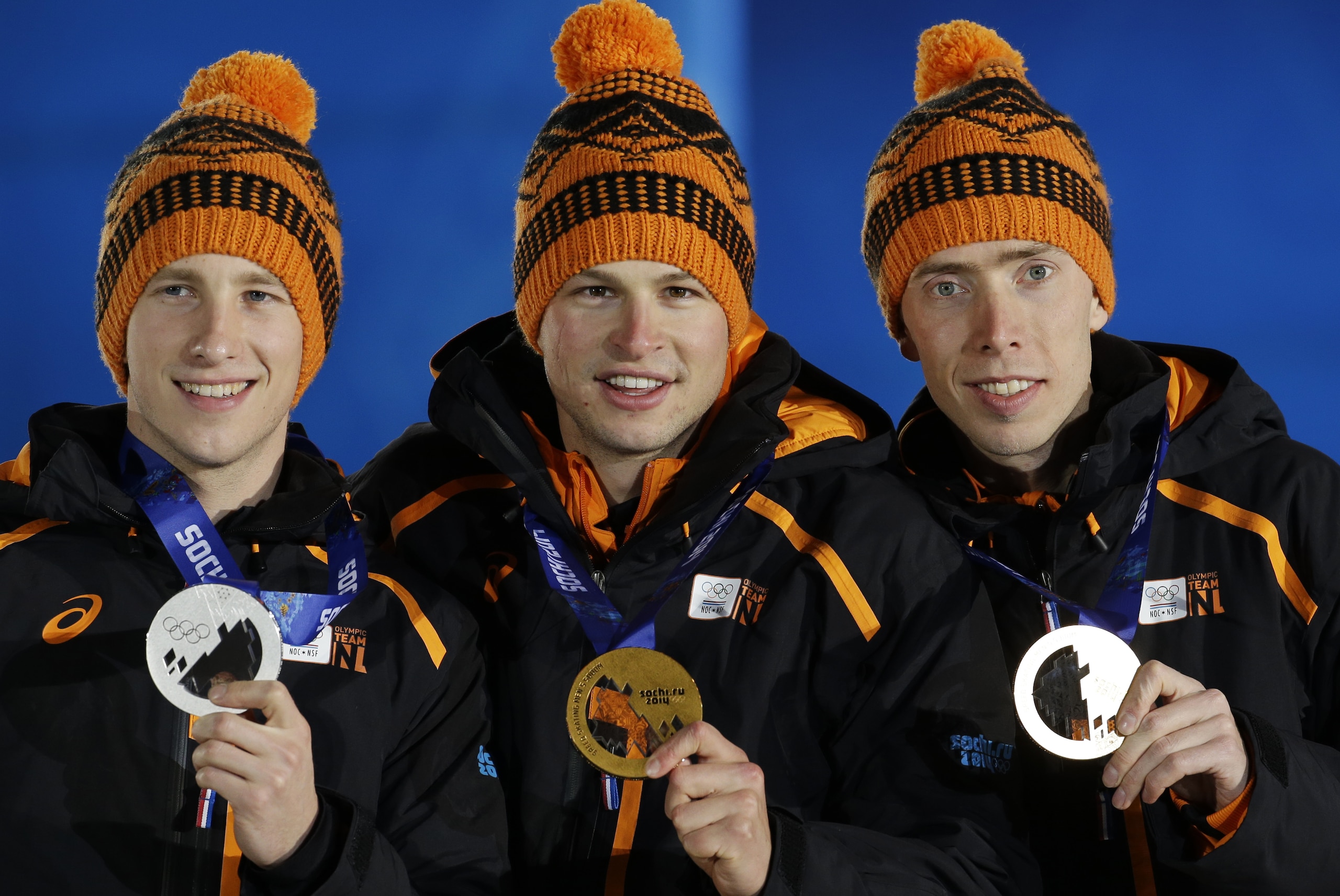 Men’s 5,000-meter speedskating medalists from the Netherlands, from left, Jan Blokhuijsen, silver, Sven Kramer, gold, and Jorrit Bergsma, bronze, pose during their medals ceremony at the 2014 Winter Olympics, Sunday, Feb. 9, 2014, in Sochi, Russia. (AP Photo/Morry Gash)