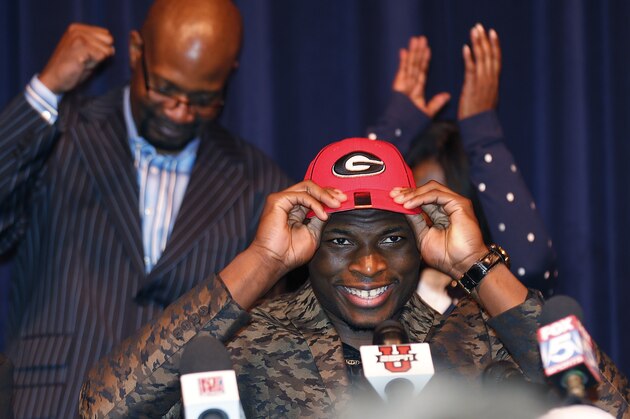 Norcross High School defensive end Lorenzo Carter announces that he plans to attend Georgia and play football, during a news conference Wednesday, Feb. 5, 2014, in Norcorss, Ga. Carter is regarded as the top prospect in Georgia and one of the top pass-rushers in the nation. (AP Photo/John Bazemore)