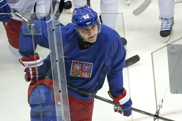 Czech Republic forward Jaromir Jagr listens as a coach draws up a play during a training session at the Bolshoy Ice Dome at the the 2014 Winter Olympics, Tuesday, Feb. 11, 2014, in Sochi, Russia. (AP Photo/Julio Cortez)