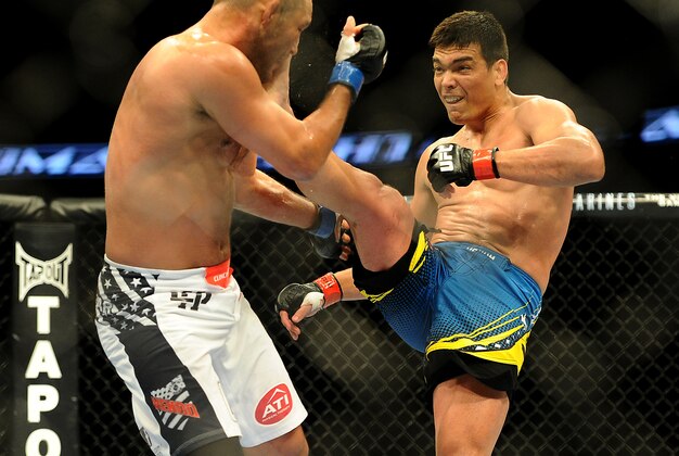 Feb 23, 2013; Anaheim, CA, USA; Dan Henderson (blue gloves) fights Lyoto Machida (red gloves) during their UFC welterweight bout at the Honda Center. Mandatory Credit: Jayne Kamin-Oncea-USA TODAY Sports