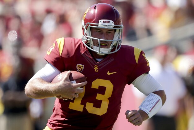 Southern California quarterback Max Wittek runs during the second half of an NCAA college football game against Boston College in Los Angeles, Saturday, Sept. 14, 2013. USC won 35-7. (AP Photo/Chris Carlson)