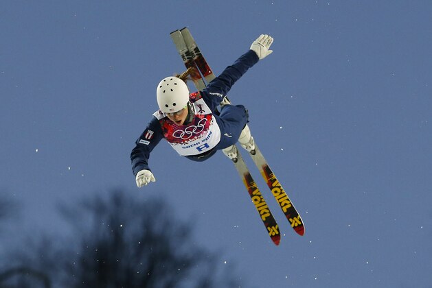 Ashley Caldwell of the United States jumps during a freestyle skiing aerials training session at the Rosa Khutor Extreme Park, at the 2014 Winter Olympics, Thursday, Feb. 13, 2014, in Krasnaya Polyana, Russia. (AP Photo/Sergei Grits)