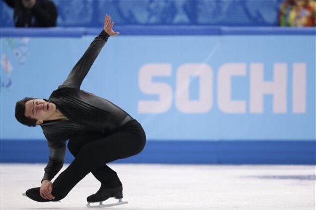 CORRECTS ID TO PATRICK CHAN OF CANADA - Patrick Chan of Canada competes in the men's short program figure skating competition at the Iceberg Skating Palace during the 2014 Winter Olympics, Thursday, Feb. 13, 2014, in Sochi, Russia. (AP Photo/Bernat Armangue)