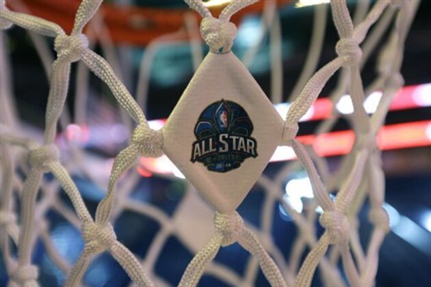 The NBA All-Star logo is affixed to a net as workers prepare the Smoothie King Center for the NBA All-Star events, which run through the end of the week in New Orleans, Thursday, Feb. 13, 2014. (AP Photo/Gerald Herbert)