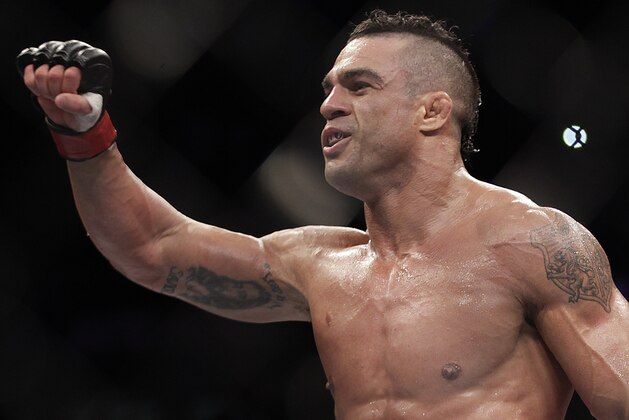 Vitor Belfort, from Brazil, celebrates after defeating Michael Bisping, from Britain during their  middleweight mixed martial arts bout at the Ultimate Fighting Championship (UFC) in Sao Paulo, Brazil, Sunday, Jan. 20, 2013. (AP Photo/Andre Penner)
