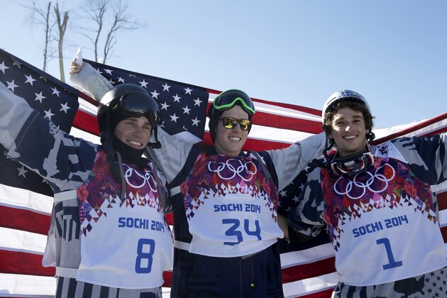 Men's ski slopestyle medalists from the United States Gus Kenworthy, left, silver, Joss Christensen, center, gold, and Nicholas Goepper, bronze, right, pose for photographers at the Rosa Khutor Extreme Park, at the 2014 Winter Olympics, Thursday, Feb. 13, 2014, in Krasnaya Polyana, Russia.(AP Photo/Gero Breloer)