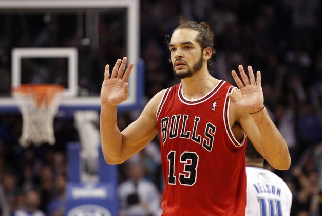 Jan 15, 2014; Orlando, FL, USA; Chicago Bulls center Joakim Noah (13) reacts against the Orlando Magic during the second half at Amway Center. Chicago Bulls defeated the Orlando Magic 128-125. Mandatory Credit: Kim Klement-USA TODAY Sports