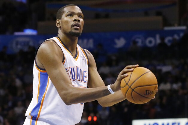 Oklahoma City Thunder forward Kevin Durant (35) shoots a foul shot against the Minnesota Timberwolves in the third quarter of an NBA basketball game in Oklahoma City, Wednesday, Feb. 5, 2014. Oklahoma City won 106-97. (AP Photo/Sue Ogrocki)