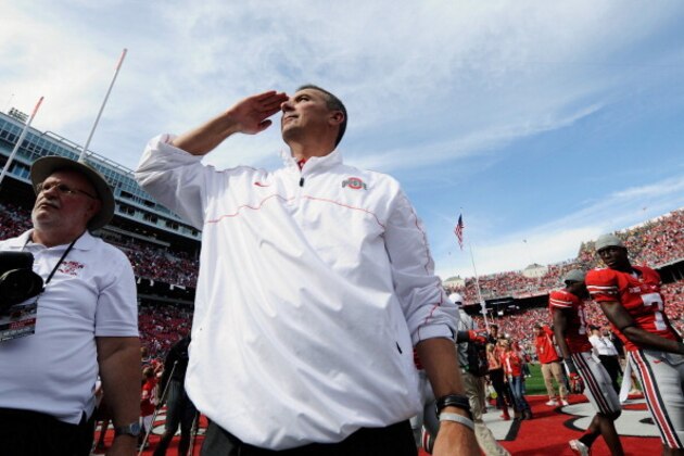 COLUMBUS, OH - SEPTEMBER 15:  Head Coach Urban Meyer of the Ohio State Buckeyes salutes the students after Ohio State defeated the California Golden Bears 35-28 at Ohio Stadium on September 15, 2012 in Columbus, Ohio.  (Photo by Jamie Sabau/Getty Images)