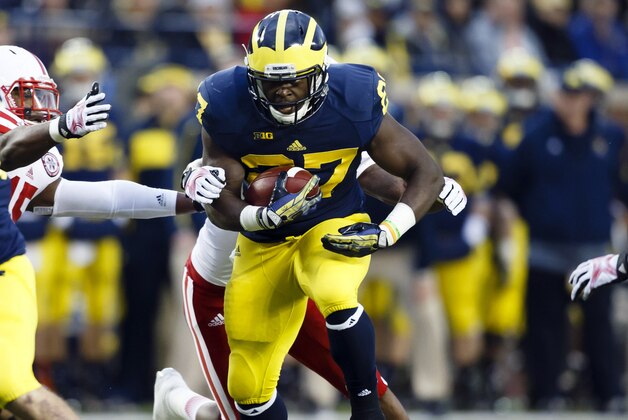 Nov 9, 2013; Ann Arbor, MI, USA; Michigan Wolverines running back Derrick Green (27) runs the ball against the Nebraska Cornhuskers in the second quarter at Michigan Stadium. Mandatory Credit: Rick Osentoski-USA TODAY Sports