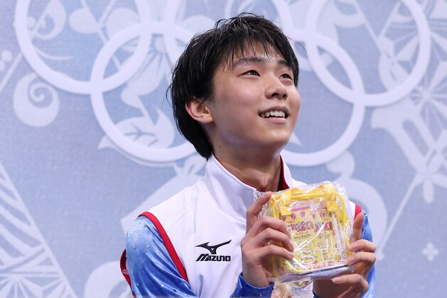 SOCHI, RUSSIA - FEBRUARY 13:  Yuzuru Hanyu of Japan waits for his score after competing during the Men's Figure Skating Short Program on day 6 of the Sochi 2014 Winter Olympics at the at Iceberg Skating Palace on February 13, 2014 in Sochi, Russia.  (Photo by Robert Cianflone/Getty Images)