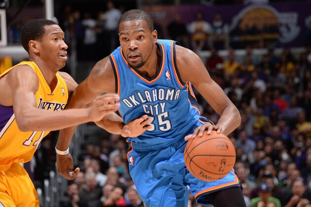 LOS ANGELES, CA - FEBRUARY 13: Kevin Durant #35 of the Oklahoma City Thunder dribbles against Wesley Johnson #11 of the Los Angeles Lakers at Staples Center on February 13, 2014 in Los Angeles, California. NOTE TO USER: User expressly acknowledges and agrees that, by downloading and/or using this Photograph, user is consenting to the terms and conditions of the Getty Images License Agreement. Mandatory Copyright Notice: Copyright 2014 NBAE (Photo by Andrew D. Bernstein/NBAE via Getty Images)