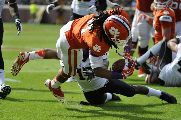 Clemson running back Zac Brooks (24) dives for a touchdown as  Wake Forest Demon Deacons safety A.J. Marshall (17) defends during the first half of an NCAA college football game, Saturday, Sept. 28, 2013, in Clemson, S.C. (AP Photo/Rainier Ehrhardt)