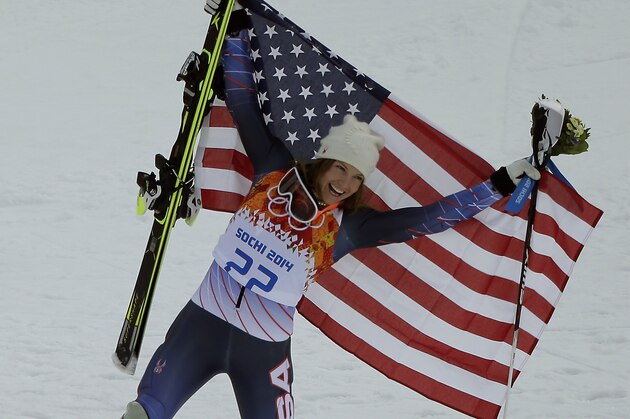 Women's supercombined bronze medalist United States' Julia Mancuso celebrates at a flower ceremony at the Alpine ski venue at the Sochi 2014 Winter Olympics, Monday, Feb. 10, 2014, in Krasnaya Polyana, Russia. (AP Photo/Charlie Riedel)