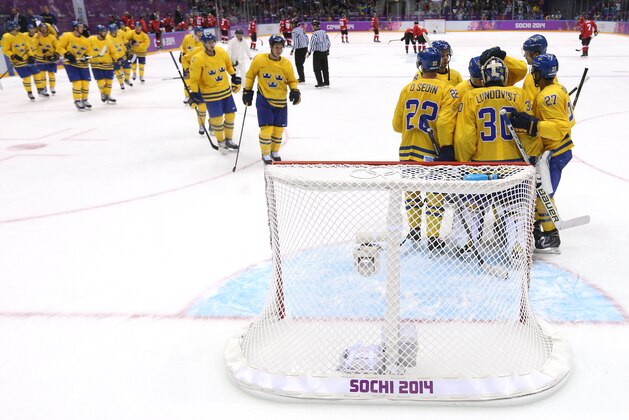 SOCHI, RUSSIA - FEBRUARY 14: Team Sweden celebrate after defeating Switzerland 1-0 during the Men's Ice Hockey Preliminary Round Group C game on day seven of the Sochi 2014 Winter Olympics at Bolshoy Ice Dome on February 14, 2014 in Sochi, Russia.  (Photo by Bruce Bennett/Getty Images)