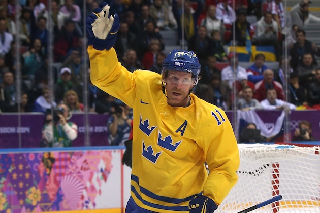 SOCHI, RUSSIA - FEBRUARY 14:  Daniel Alfredsson #11 of Sweden celebrates after a goal in the third period against Switzerland during the Men's Ice Hockey Preliminary Round Group C game on day seven of the Sochi 2014 Winter Olympics at Bolshoy Ice Dome on February 14, 2014 in Sochi, Russia.  (Photo by Bruce Bennett/Getty Images)