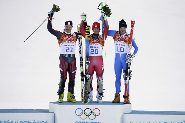 Men's supercombined medalists from left, Croatia's Ivica Kostelic (silver), Switzerland's Sandro Viletta (gold) and Italy's Christof Innerhofer (bronze) pose for photographers on the podium during a flower ceremony at the Alpine ski venue at the Sochi 2014 Winter Olympics, Friday, Feb. 14, 2014, in Krasnaya Polyana, Russia. (AP Photo/Gero Breloer)