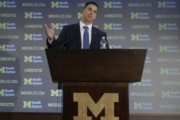 Doug Nussmeier is introduced as Michigan's NCAA college football offensive coordinator and quarterbacks coach during a news conference at the Junge Center in Ann Arbor, Mich., Friday, Jan. 10, 2014. Nussmeier is the former Alabama offensive coordinator. (AP Photo/Carlos Osorio)