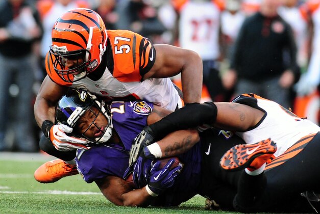 Nov 10, 2013; Baltimore, MD, USA; Baltimore Ravens running back Ray Rice (27) gets tackled by Cincinnati Bengals linebacker Vincent Rey (57) at M&T Bank Stadium. Mandatory Credit: Evan Habeeb-USA TODAY Sports Nov 10, 2013; Baltimore, MD, USA; Baltimore Ravens running back Ray Rice (27) gets tackled by Cincinnati Bengals linebacker Vincent Rey (57) at M&T Bank Stadium. Mandatory Credit: Evan Habeeb-USA TODAY Sports