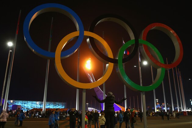 SOCHI, RUSSIA - FEBRUARY 07:  The flame is seen through the Olympic Rings after the Opening Ceremony of the Sochi 2014 Winter Olympics at Fisht Olympic Stadium on February 7, 2014 in Sochi, Russia.  (Photo by Robert Cianflone/Getty Images)