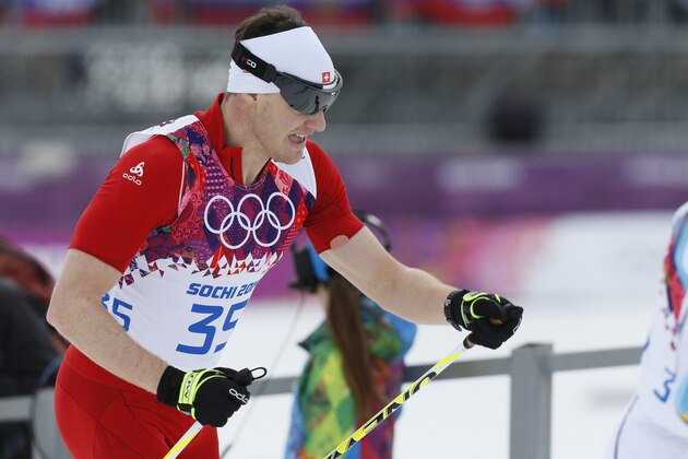 Switzerland's gold medal winner Dario Cologna skis during the men's 15K classical-style cross-country race at the 2014 Winter Olympics, Friday, Feb. 14, 2014, in Krasnaya Polyana, Russia. (AP Photo/Dmitry Lovetsky)