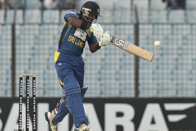 Sri Lanka’s Kusal Perera plays a shot during the first Twenty 20 cricket match against Bangladesh in Chittagong, Bangladesh, Wednesday, Feb. 12, 2014. Sri Lanka won by 2 runs. (AP Photo)