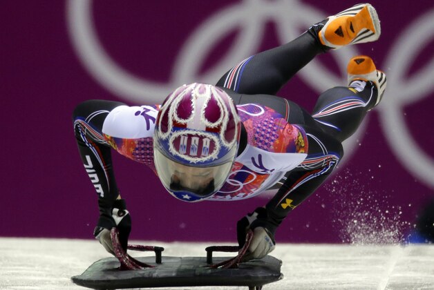 Noelle Pikus-Pace of the United States starts her final run during the women's skeleton competition at the 2014 Winter Olympics, Friday, Feb. 14, 2014, in Krasnaya Polyana, Russia. Pikus-Pace won the silver medal. (AP Photo/Natacha Pisarenko)