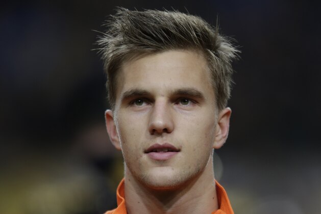 Netherlands' Joel Veltman sings the national anthem during the lineup prior to the  international friendly soccer match between Netherlands and Colombia at ArenA stadium in Amsterdam, Netherlands, Tuesday Nov. 19, 2013. (AP Photo/Peter Dejong)