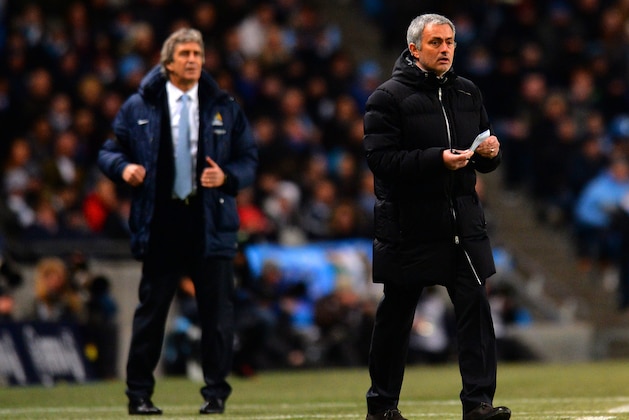 MANCHESTER, ENGLAND - FEBRUARY 03: Manuel Pellegrini manager of Manchester City and Jose Mourinho manager of Chelsea give instructions during the Barclays Premier League match between Manchester City and Chelsea at Etihad Stadium on February 3, 2014 in Manchester, England.  (Photo by Shaun Botterill/Getty Images)