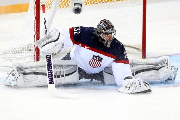 SOCHI, RUSSIA - FEBRUARY 13:  Jonathan Quick #32 of United States saves a goal against Slovakia during the Men's Ice Hockey Preliminary Round Group A game on day six of the Sochi 2014 Winter Olympics at Shayba Arena on February 13, 2014 in Sochi, Russia.  (Photo by Streeter Lecka/Getty Images)