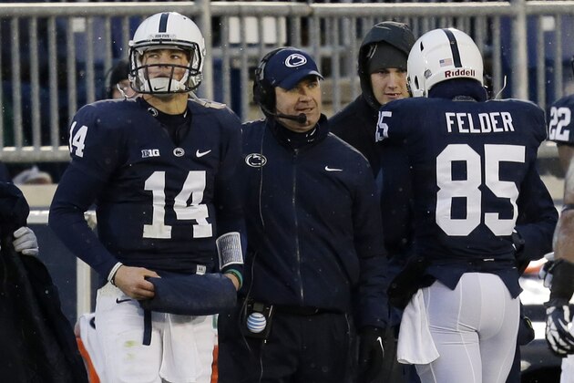 Penn State quarterback Christian Hackenberg (14) stands on the sidelines next to Penn State head coach Bill O' Brien during the second quarter of an NCAA college football game against Nebraska  in State College, Pa., Saturday, Nov. 23, 2013. (AP Photo/Gene J. Puskar)