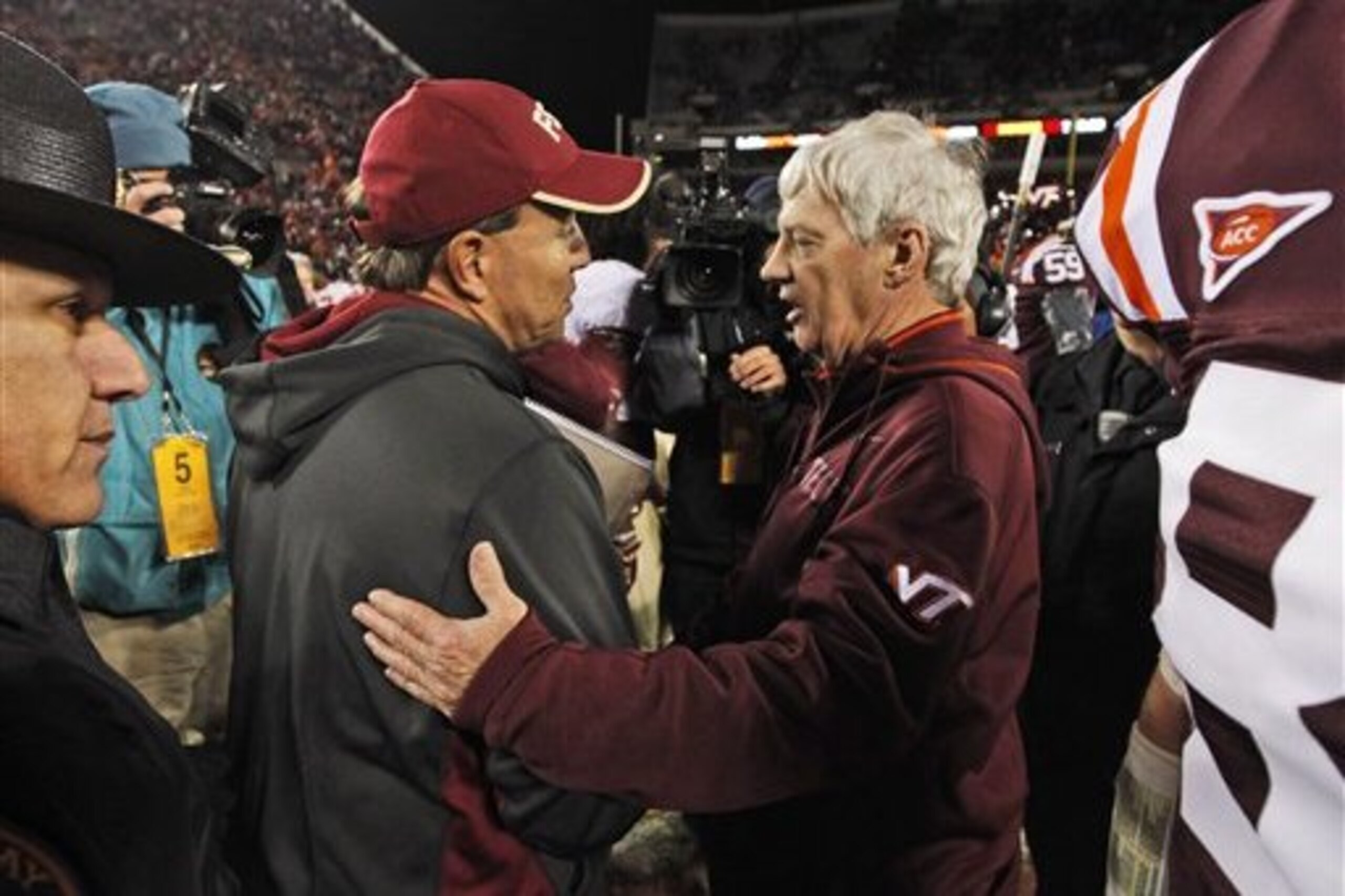Florida State coach Jimbo Fisher, left, and Virginia coach, Frank Beamer greet each other after an NCAA college football game in Blacksburg, Va., Thursday, Nov. 8, 2012. Florida State won 28-22. (AP Photo/Steve Helber)