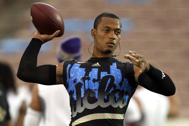 UCLA quarterback Brett Hundley works on his passing to warm up to play against Washington in their NCAA college football game Friday, Nov. 15, 2013, in Pasadena, Calif.  (AP Photo/Alex Gallardo)