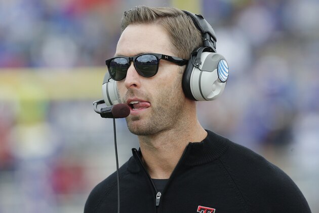 Texas Tech coach Kliff Kingsbury watches play from the sidelines during the first half of an NCAA college football game against Kansas in Lawrence, Kan., Saturday, Oct. 5, 2013. (AP Photo/Orlin Wagner)