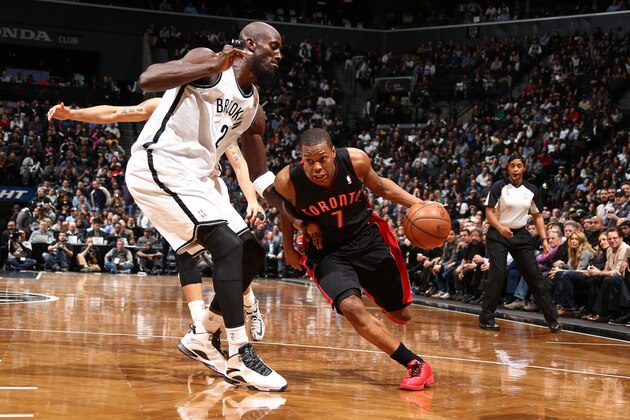 BROOKLYN, NY - JANUARY 27: Kyle Lowry #7 of the Toronto Raptor drives against Kevin Garnett #30 of the Brooklyn Nets during a game at Barclays Center in Brooklyn. NOTE TO USER: User expressly acknowledges and agrees that, by downloading and or using this photograph, User is consenting to the terms and conditions of the Getty Images License Agreement. Mandatory Copyright Notice: Copyright 2014 NBAE (Photo by Nathaniel S. Butler/NBAE via Getty Images)