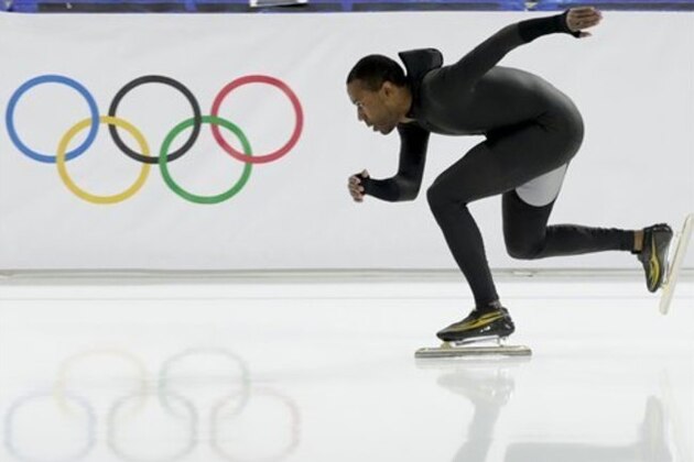Shani Davis of the U.S. skates in the prototype of the official US Speedskating suit during a training session at the Adler Arena Skating Center at the 2014 Winter Olympics, Friday, Feb. 14, 2014, in Sochi, Russia. The team thought it had a chance to do something special, given some impressive World Cup results this season and new high-tech suits from Under Armour, which got an assist in the design from aerospace giant Lockheed Martin. Now, there's plenty of grumbling that the suits are actually slowing the skaters down in Sochi. (AP Photo/Matt Dunham)