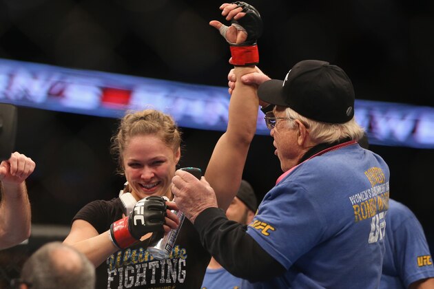 ANAHEIM, CA - FEBRUARY 23:  Ronda Rousey celebrates her UFC Bantamweight Title over Liz Carmouche with a member of her team during UFC 157 at Honda Center on February 23, 2013 in Anaheim, California.  (Photo by Jeff Gross/Getty Images)