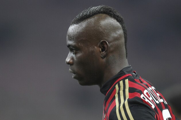 AC Milan forward Mario Balotelli walks on the field during the Serie A soccer match between AC Milan and Bologna at the San Siro stadium in Milan, Italy, Friday, Feb. 14, 2014. (AP Photo/Antonio Calanni) AC Milan forward Mario Balotelli walks on the field during the Serie A soccer match between AC Milan and Bologna at the San Siro stadium in Milan, Italy, Friday, Feb. 14, 2014. (AP Photo/Antonio Calanni)