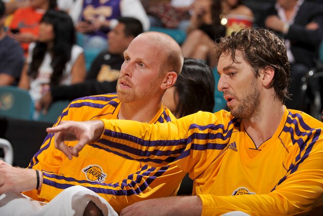 LAS VEGAS, NEVADA - OCTOBER 10:  Chris Kaman #9 and Pau Gasol #16 of the Los Angeles Lakers discus a play during the game against the Sacramento Kings at the MGM Grand Garden Arena on October 10, 2013 in Las Vegas, Nevada. NOTE TO USER: User expressly acknowledges and agrees that, by downloading and/or using this Photograph, user is consenting to the terms and conditions of the Getty Images License Agreement. Mandatory Copyright Notice: Copyright 2013 NBAE (Photo by Garrett W. Ellwood/NBAE via Getty Images)