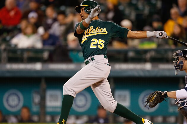 SEATTLE, WA - SEPTEMBER 29:  Chris Young #25 of the Oakland Athletics hits a two run RBI single in the second inning against the Seattle Mariners at Safeco Field on September 29, 2013 in Seattle, Washington. The Athletics defeated the Mariners 9-0.  (Photo by Otto Greule Jr/Getty Images)
