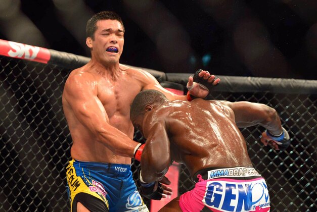 Aug 3, 2013; Rio De Janeiro, Brazil; Phil Davis (pink shorts) fights against Lyoto Machida (blue shorts) during UFC 163 at HSBC Arena. Mandatory Credit: Jason Silva-USA TODAY Sports