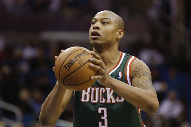 Milwaukee Bucks' Caron Butler (3) shoots a free throw against the Orlando Magic during the first half of an NBA basketball game in Orlando, Fla., Friday, Jan. 31, 2014.(AP Photo/John Raoux)
