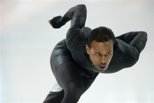 Shani Davis of the U.S. skates in the prototype of the official US Speedskating suit during a training session at the Adler Arena Skating Center at the 2014 Winter Olympics, Friday, Feb. 14, 2014, in Sochi, Russia. The team thought it had a chance to do something special, given some impressive World Cup results this season and new high-tech suits from Under Armour, which got an assist in the design from aerospace giant Lockheed Martin. Now, there's plenty of grumbling that the suits are actually slowing the skaters down in Sochi. (AP Photo/Pavel Golovkin)