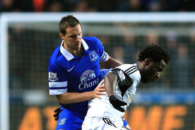 SWANSEA, WALES - DECEMBER 22: Wilfried Bony of Swansea is challenged by Phil Jagielka of Everton during the Barclays Premier League match between Swansea City and Everton at the Liberty Stadium on December 22, 2013 in Swansea, Wales. (Photo by Richard Heathcote/Getty Images) SWANSEA, WALES - DECEMBER 22: Wilfried Bony of Swansea is challenged by Phil Jagielka of Everton during the Barclays Premier League match between Swansea City and Everton at the Liberty Stadium on December 22, 2013 in Swansea, Wales. (Photo by Richard Heathcote/Getty Images)