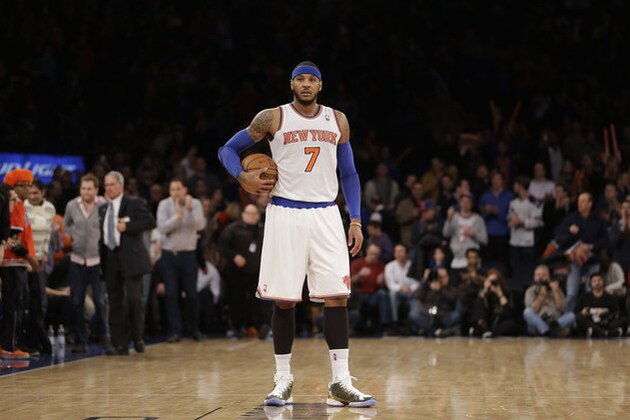New York Knicks' Carmelo Anthony holds the ball at the second half of the NBA basketball game against the Los Angeles Lakers at Madison Square Garden Sunday, Jan. 26, 2014, in New York. The Knicks defeated the Lakers 110-103. (AP Photo/Seth Wenig)
