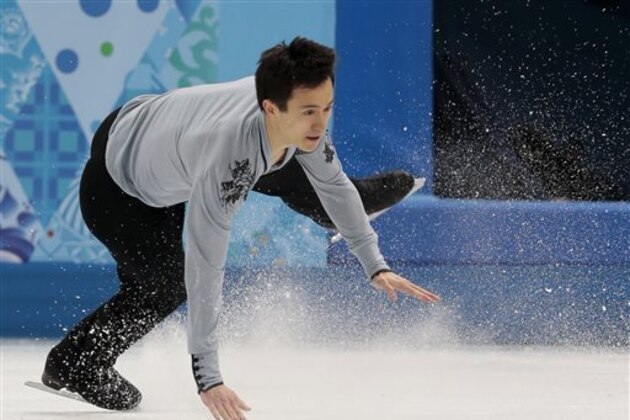 Patrick Chan of Canada falls as he competes in the men's free skate figure skating final at the Iceberg Skating Palace during the 2014 Winter Olympics, Friday, Feb. 14, 2014, in Sochi, Russia. (AP Photo/Ivan Sekretarev)