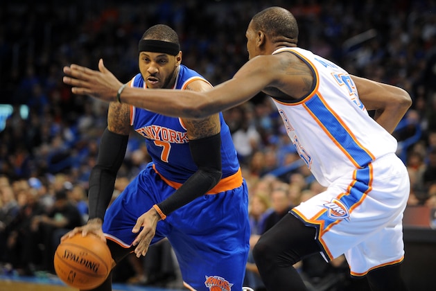 Feb 9, 2014; Oklahoma City, OK, USA; New York Knicks small forward Carmelo Anthony (7) dribbles the ball as Oklahoma City Thunder small forward Kevin Durant (35) defends during the first quarter at Chesapeake Energy Arena. Mandatory Credit: Mark D. Smith-USA TODAY Sports