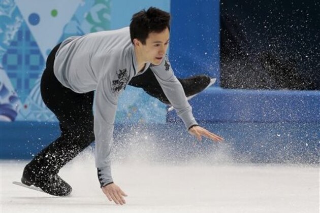 Patrick Chan of Canada falls as he competes in the men's free skate figure skating final at the Iceberg Skating Palace during the 2014 Winter Olympics, Friday, Feb. 14, 2014, in Sochi, Russia. (AP Photo/Ivan Sekretarev)