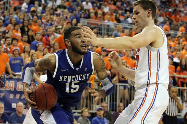 February 12, 2013; Gainesville, FL, USA; Kentucky Wildcats forward Willie Cauley-Stein (15) drives to the basket as Florida Gators forward/center Erik Murphy (33) defends during the second half at the Stephen C. O'Connell Center. Florida won 69-52. Mandatory USA TODAY Sports