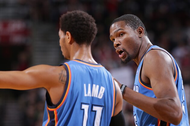 PORTLAND, OR - DECEMBER 4:  Kevin Durant #35 and Jeremy Lamb #11 of the Oklahoma City Thunder talk during the game against the Portland Trail Blazers on December 4, 2013 at the Moda Center Arena in Portland, Oregon. NOTE TO USER: User expressly acknowledges and agrees that, by downloading and or using this photograph, user is consenting to the terms and conditions of the Getty Images License Agreement. Mandatory Copyright Notice: Copyright 2013 NBAE (Photo by Sam Forencich/NBAE via Getty Images)